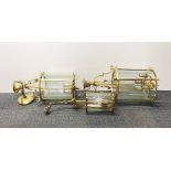 Three gilt brass porch lanterns, largest 64cm.