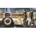 A pair of French cold painted spelter figures, together with a Buddha figure.
