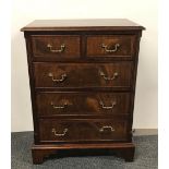 A five drawer mahogany veneered chest, 75 x 55.5 x 35cm.