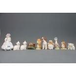 A Royal Worcester figure of a girl with a puppy, together with a group of Beswick, Royal Albert