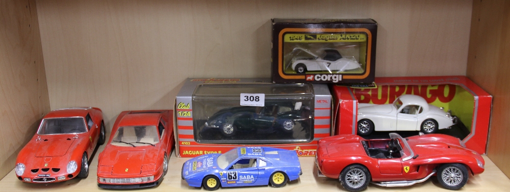 A group of mixed large scale die cast model vehicles.