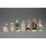 A group of seven Royal Doulton, Beswick and Royal Albert character figures.