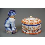 A Vista Alegre Portuguese porcelain box and cover, W. 16cm. Together with a Makkum porcelain dog.