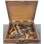 A case containing a mixed group of incomplete air guns etc.