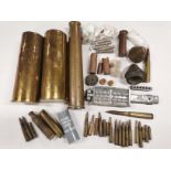 A mixed group of shell cases, shot moulds etc.