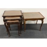 A nest of mahogany tables with inset glass top. Together with a further coffee table.