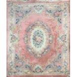 A pink ground washed wool Chinese carpet, 238 x 300cm.