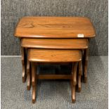 A nest of three Ercol style tables, largest size 57 x 36 x 41cm.