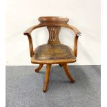 A 1920's oak swivel chair.