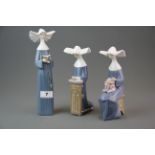 A group of three Lladro figures of nuns #5502 #5500 #5501 (all with boxes). Tallest H. 26cm.
