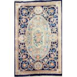 A blue ground washed wool Chinese carpet, 182 x 280cm