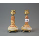 A pair of 19th century onyx and ormolu candlesticks, H. 16.5cm.
