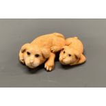 A signed Japanese carved ivory Netsuke of two dogs, W. 4.5cm.