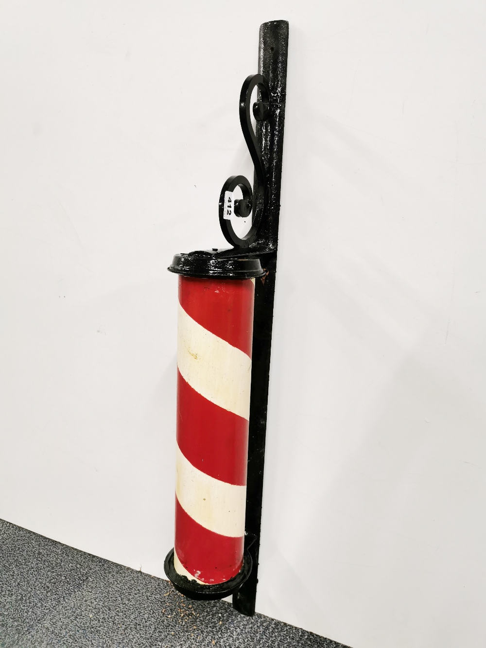 A painted cast iron barber's pole, H. 102cm.