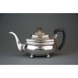 A Georgian hallmarked silver teapot, spout to handle L. 28cm.