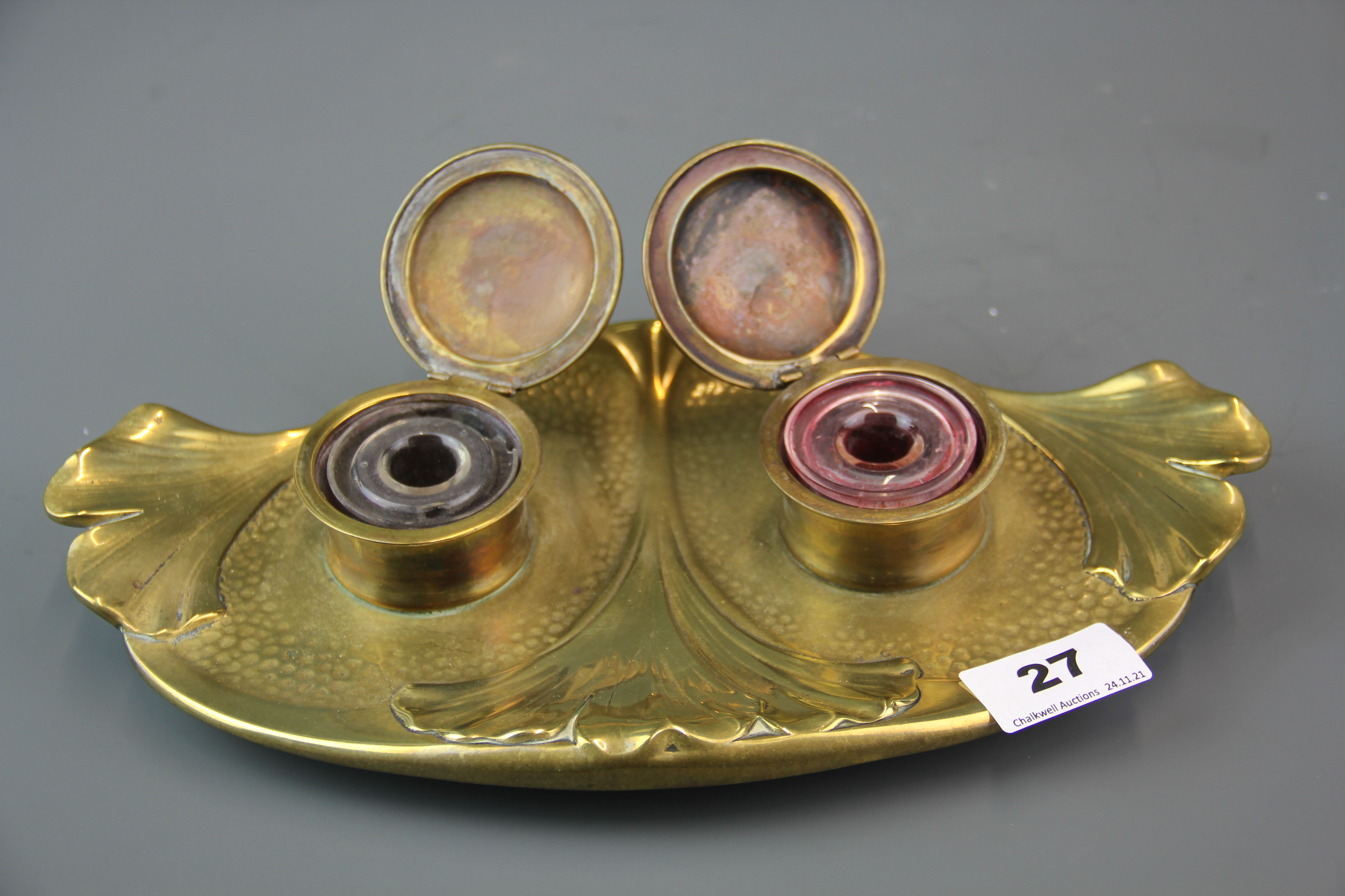 An Art Nouveau bronze inkwell stamped Geschutzt, L. 30cm. glass inkwells A/F. - Image 2 of 2