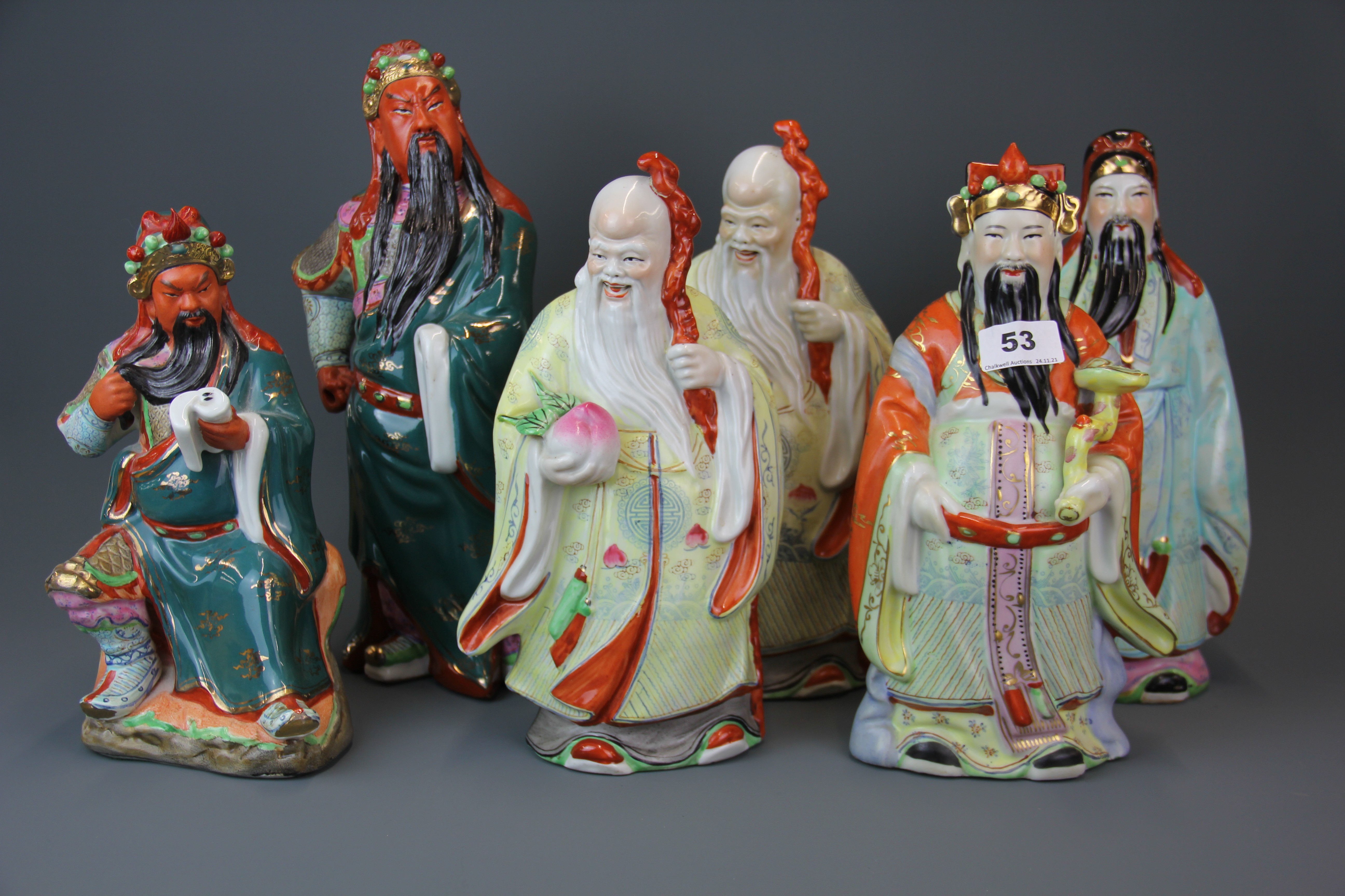 A group of six large mid 20th century Chinese porcelain figures of lucky gods, largest H. 35cm.