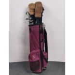 A set of graphite golf clubs with waterproofs.
