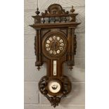 A carved oak wall clock barometer, H. 89cm.