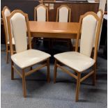 A contemporary extending dining table and six chairs,