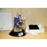 A Swarovski crystal 'Isadora' figurine with display stand and title plaque.