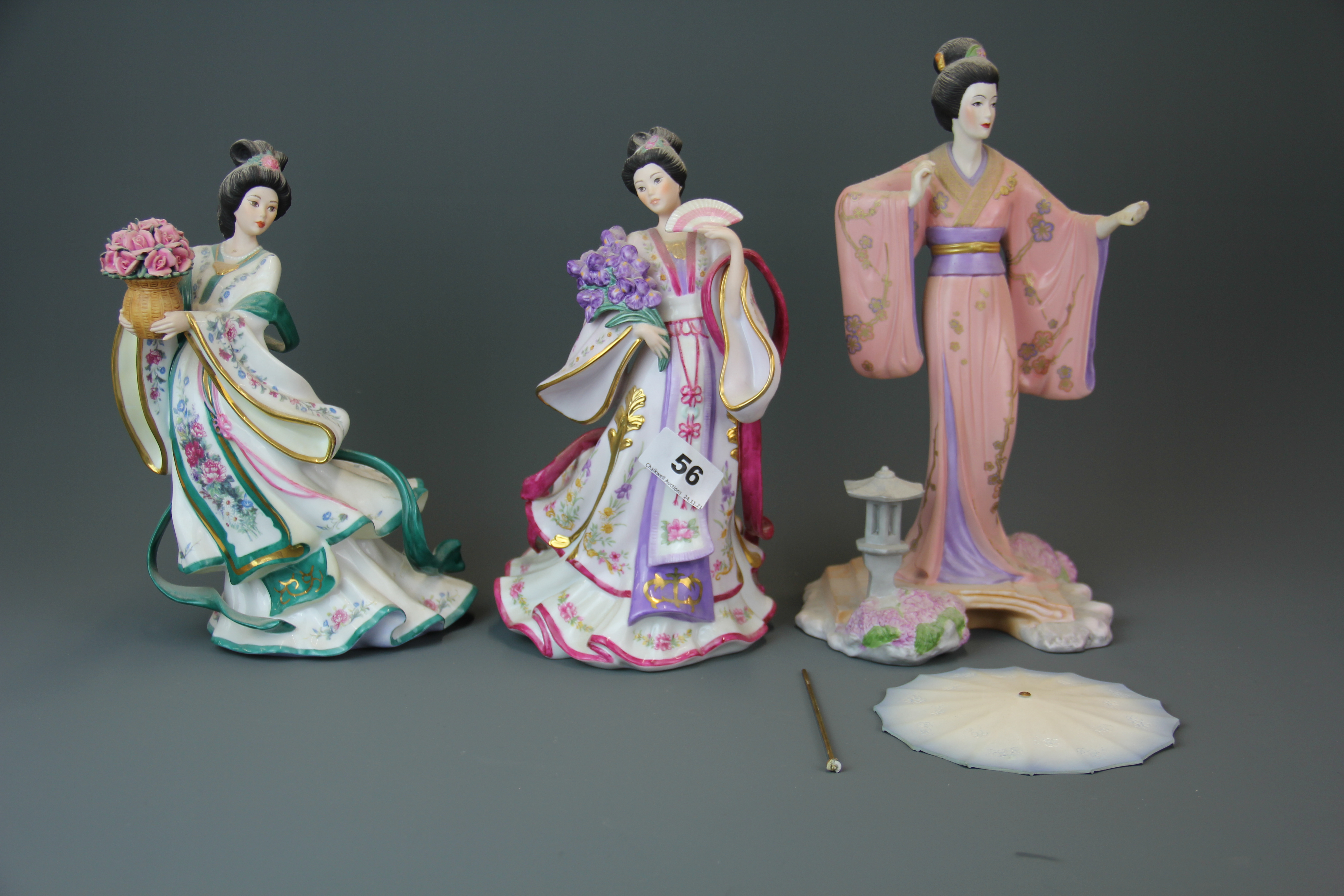 Two Danbury mint and one Franklin mint porcelain figures of oriental women, tallest H. 28cm.