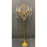 An unusual gilt and crystal standard lamp.