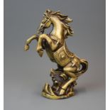 A Chinese bronze/brass figure of a rearing horse, H. 23cm.