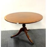 A brass inlaid regency style mahogany veneered tea table, Dia. 106cm.