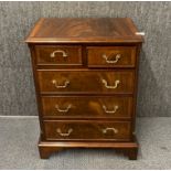 A five drawer mahogany veneered chest, 75 x 55.5 x 35cm.