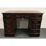 A leather topped mahogany desk, 121 x 79.5 x 61cm.