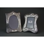 Two ornate hallmarked silver photo frames, sizes 18 x 15.5cm and 20 x 14.5cm.