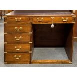 A military style brass finished six drawer oak desk, 109 x 50 x 78cm.