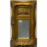 A gilt framed mirror with inset hand painted panel of a sailing ship, 70 x 39cm.