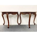 A pair of carved mahogany tables, 91 x 43cm.