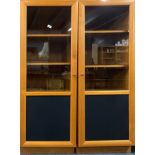 A pair of contemporary glazed teak cabinets, 55 x 55 x 157cm