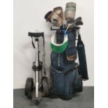 A ladies set of graphite golf clubs with trolley, Big Bertha and waterproofs.