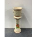 A 1970's hand painted planter on stand.