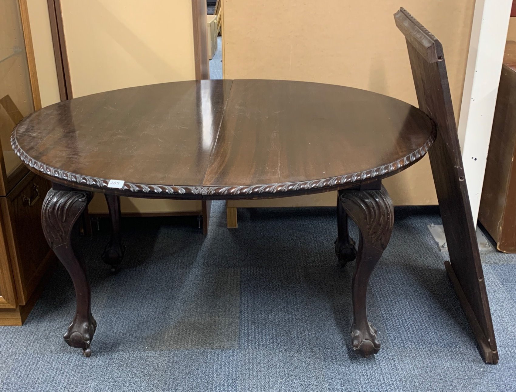A 1920's ball and claw foot extending oval mahogany dining table, 106 x 132, Extending to 186cm.