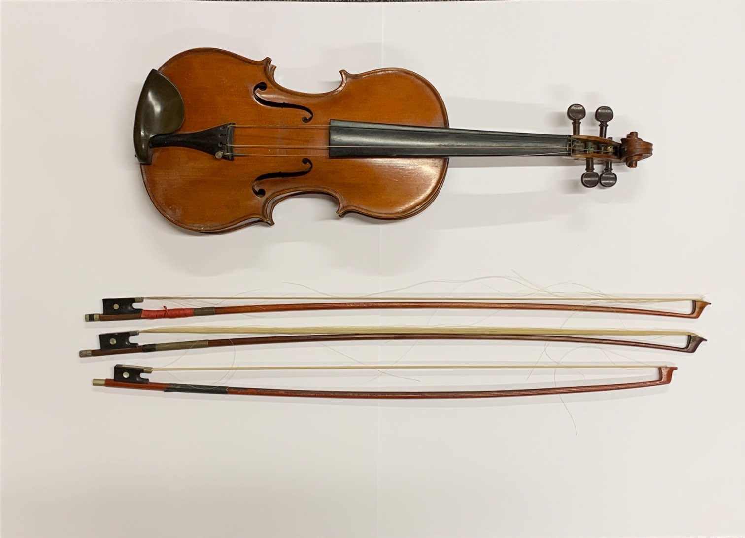 An antique cased violin with three bows, with a hand written label reading Emanuel Whitmarsh, London - Image 2 of 9