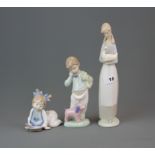 A group of three Nao figures, tallest H. 27.5cm.