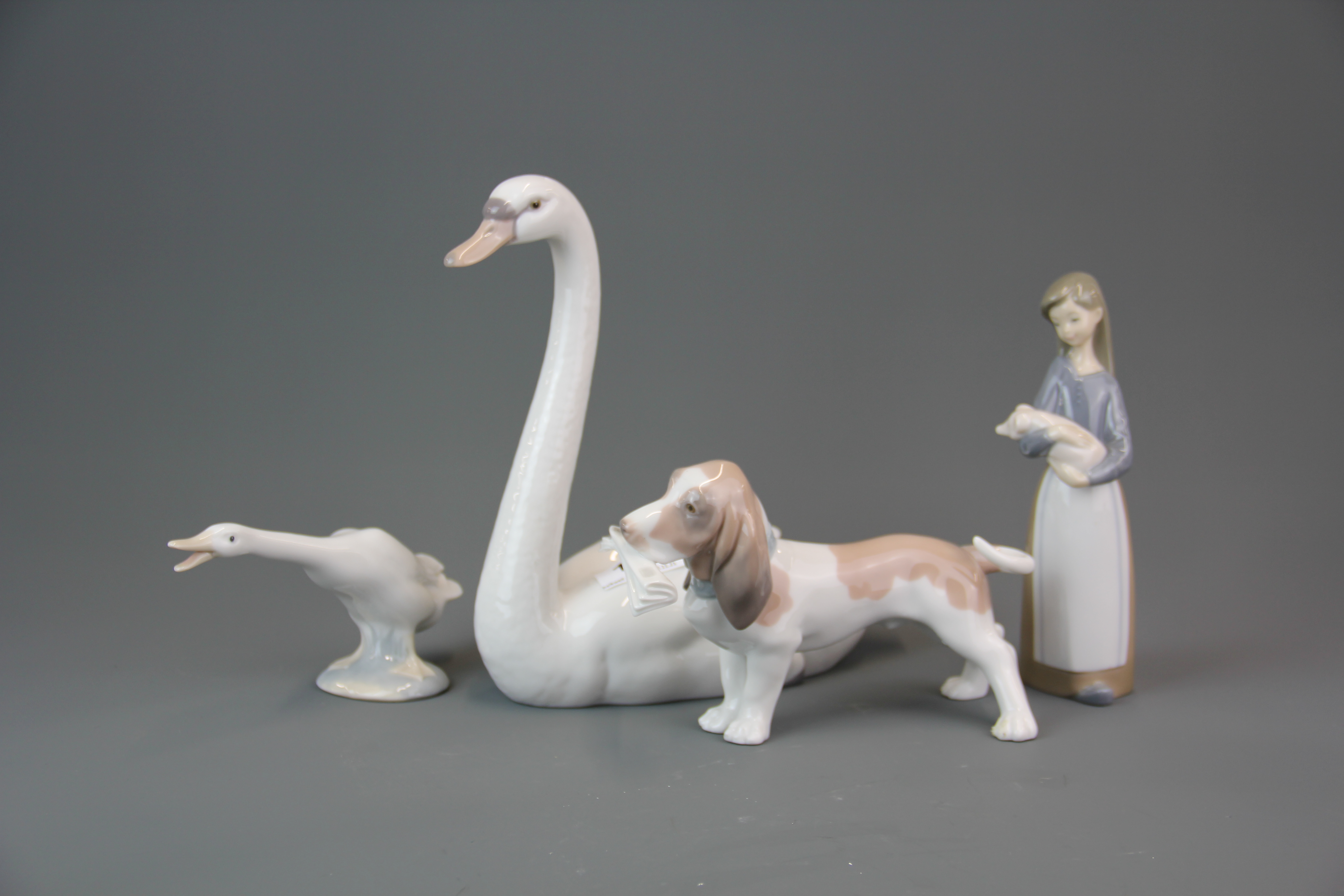 A Lladro figure of 'Graceful Swan' #5230 (with box) H. 21.5cm. together with three further Lladro