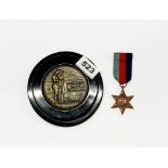 A WWII medal and a small mounted plaque for WWI.
