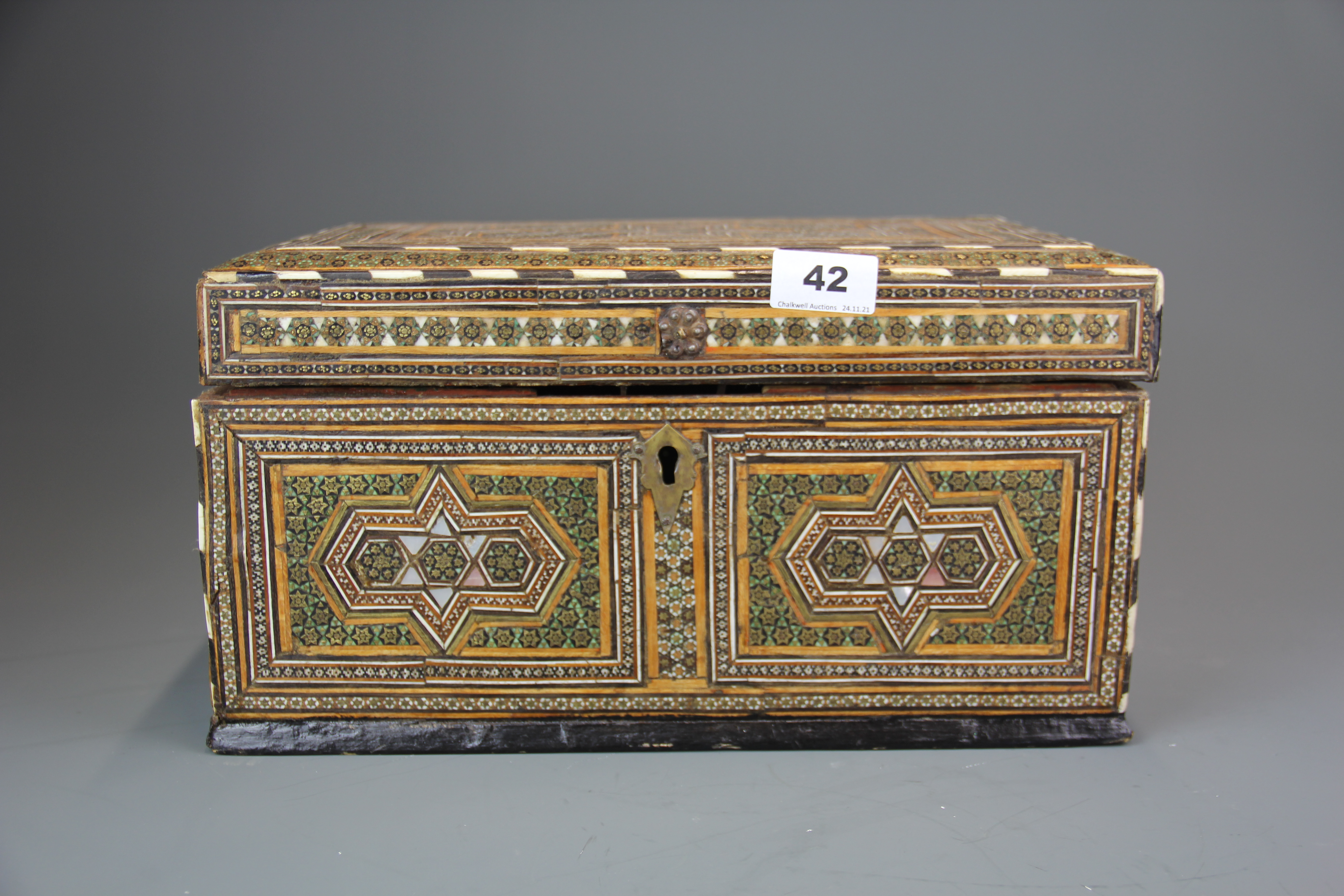 An 18th century Anglo-Indian box inlaid with mother of pearl, ivory and fine gilt metal stud work,