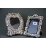 Two hallmarked silver photo frames, sizes 20 x 14cm and 21 x 17cm.