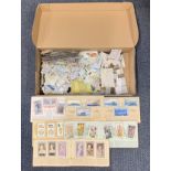 A quantity of cigarette cards etc.