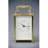 A gilt brass carriage clock, H. 15cm.