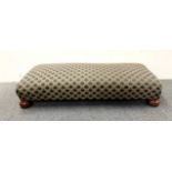 An upholstered double footstool, 42 x 100 x 21cm.