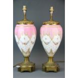 A superb pair of ormolu mounted 19th century French porcelain table lamps, H. 53cm.