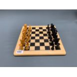 A satinwood chess set with board, king H. 6cm.